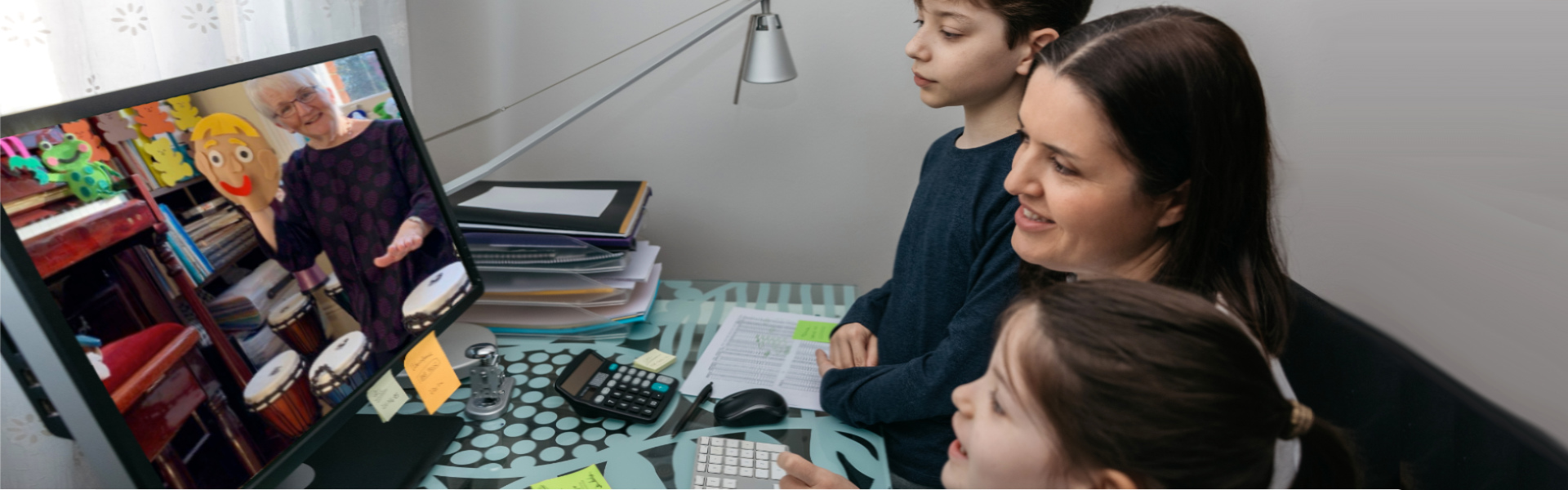 Mother and children learning songs from the online course