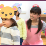 a group of diverse children holding hands and dancing and singing in a circle