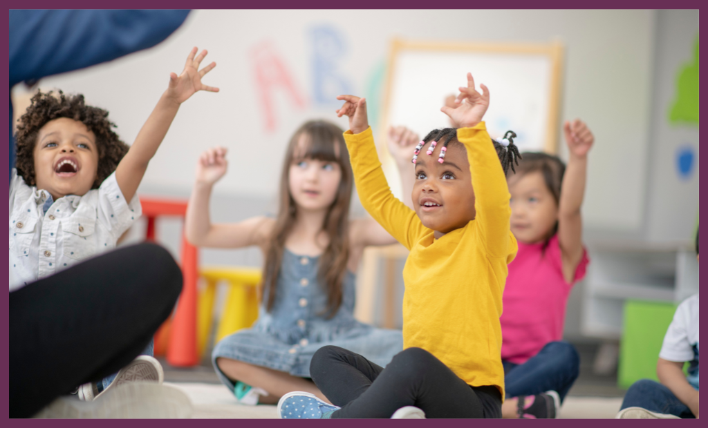 a group of diverse children holding hands and dancing and singing in a circle