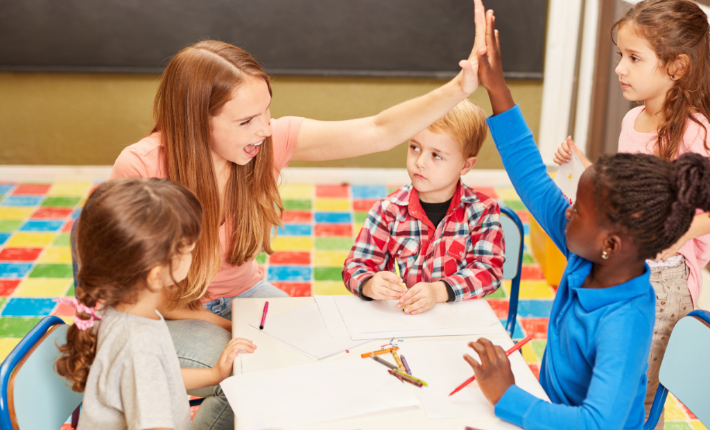 a group of diverse children holding hands and dancing and singing in a circle