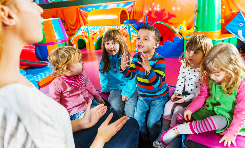 a group of diverse children holding hands and dancing and singing in a circle